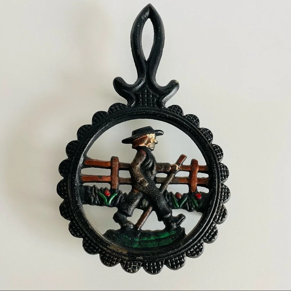 Vintage  Cast Iron Amish Woman and  man Trivets.